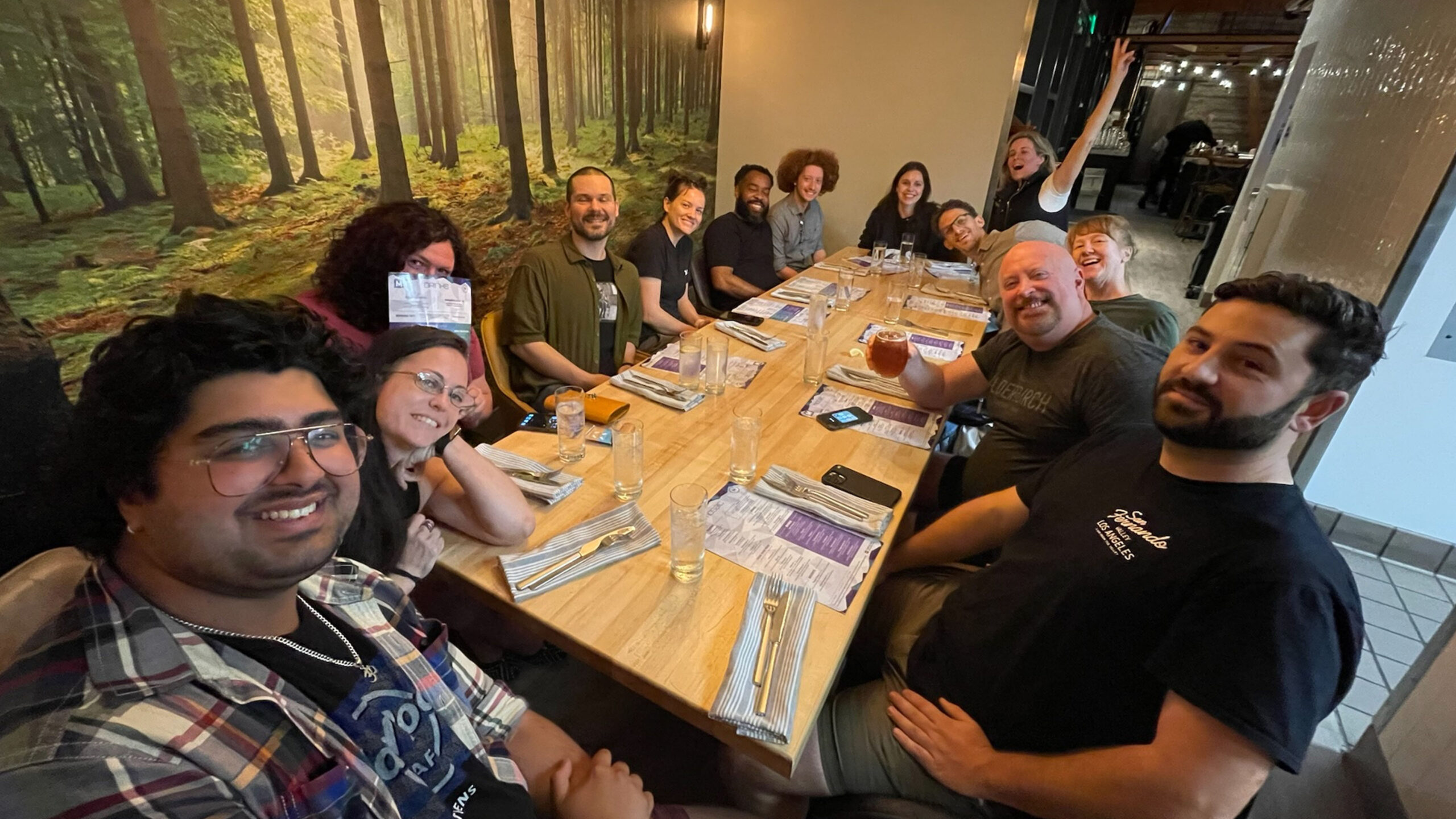 11 crew photo at dinner